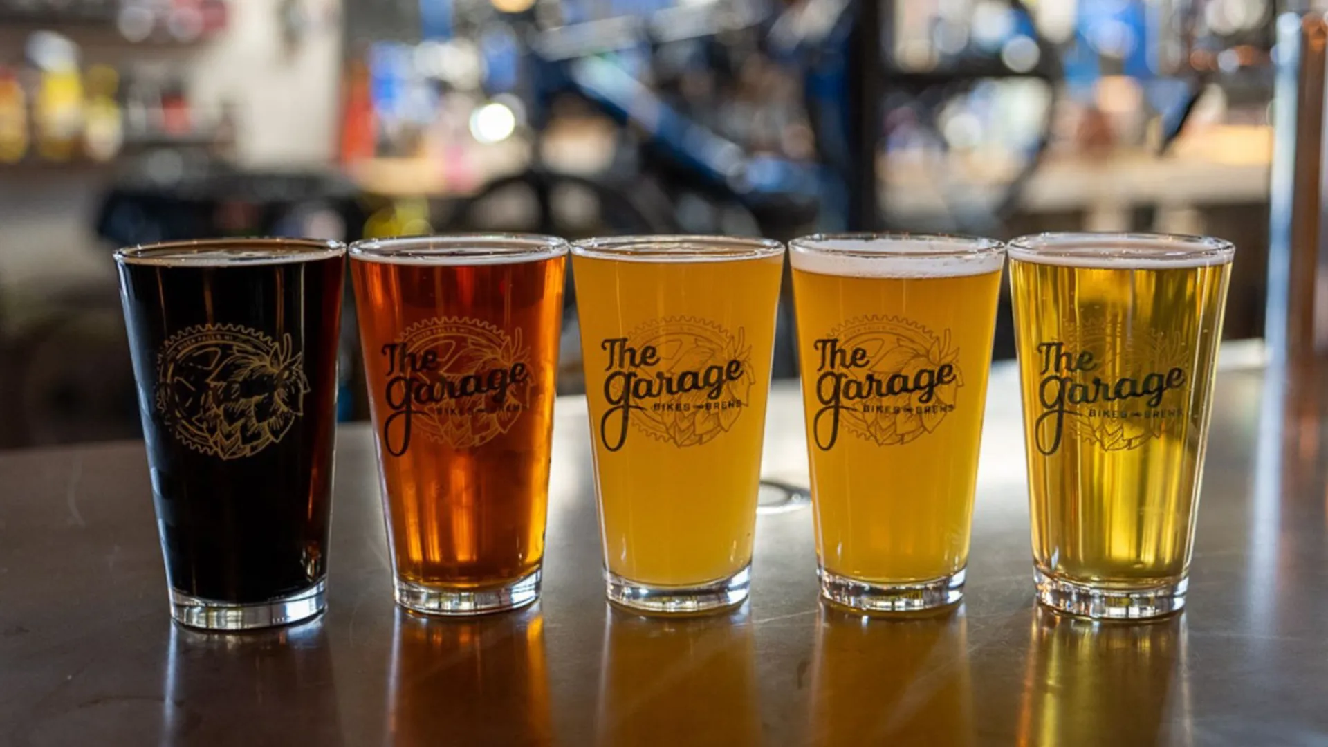 Five Garage pint glasses showing different beer colours